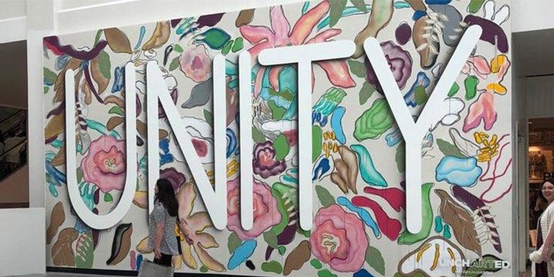 Mural of florals and the text, "Unity."