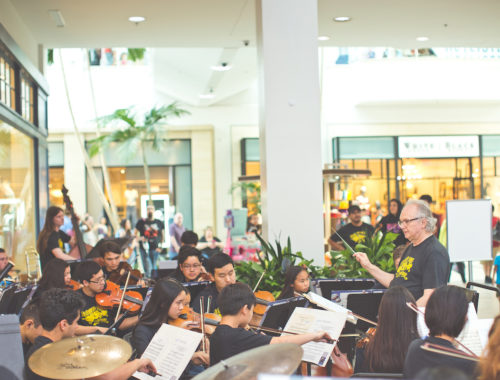 Kids orchestra and conductor