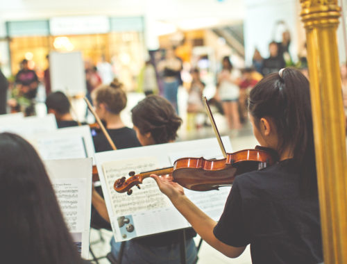 Kids orchestra playing violins