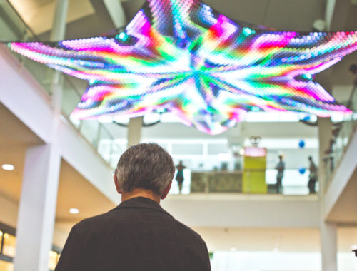 Man in front of LED constellation