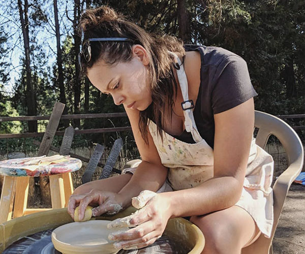 Woman making pottery