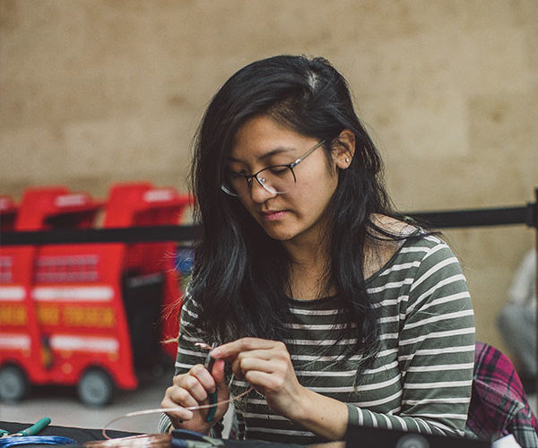 Woman crafting wire design